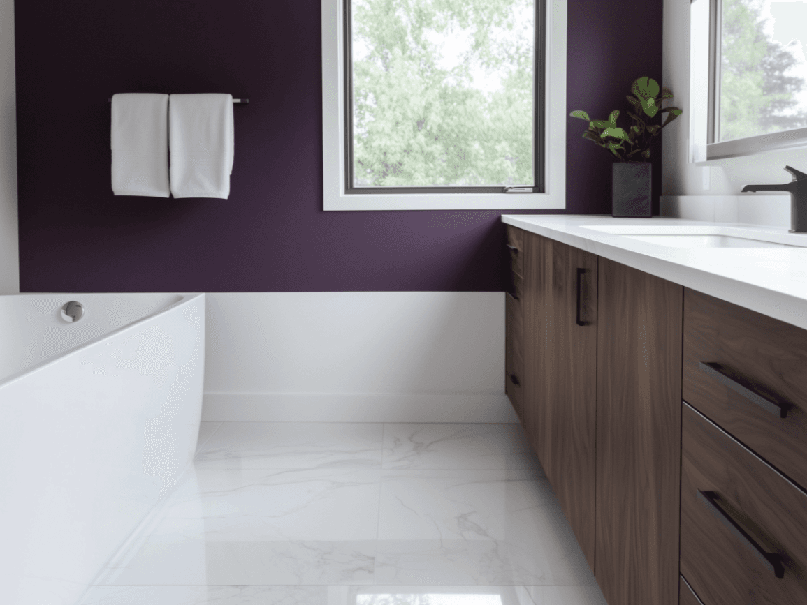 Modern bathroom with deep purple wall, white freestanding bathtub, white quartz countertop, walnut wood cabinets, glossy marble floor, and decorative plant.