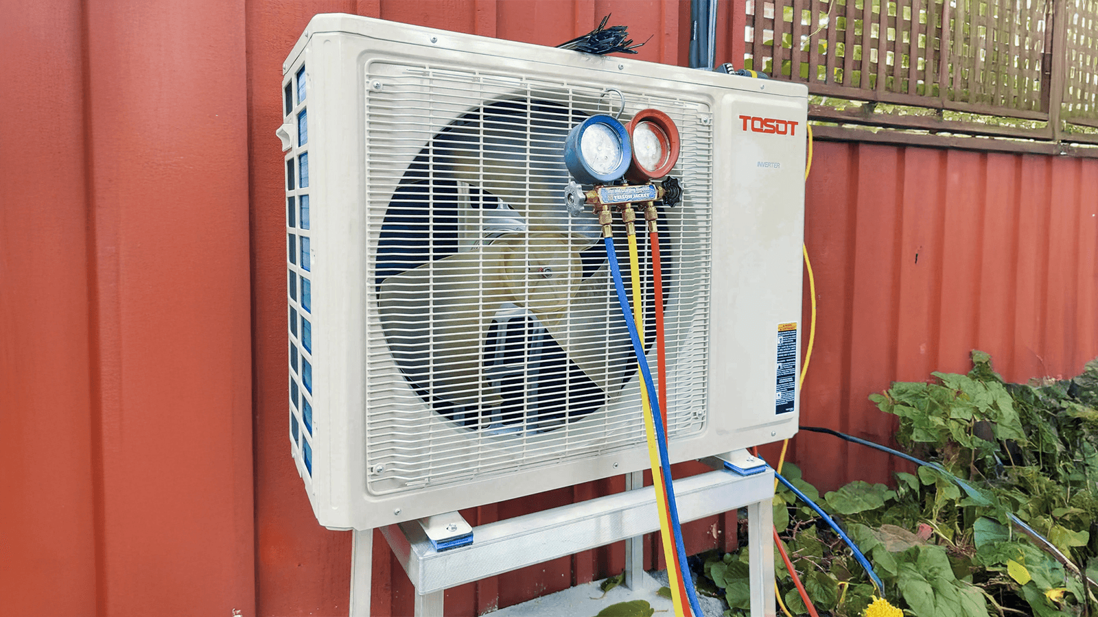 Tosot air conditioning unit with pressure gauges for system inspection and maintenance.