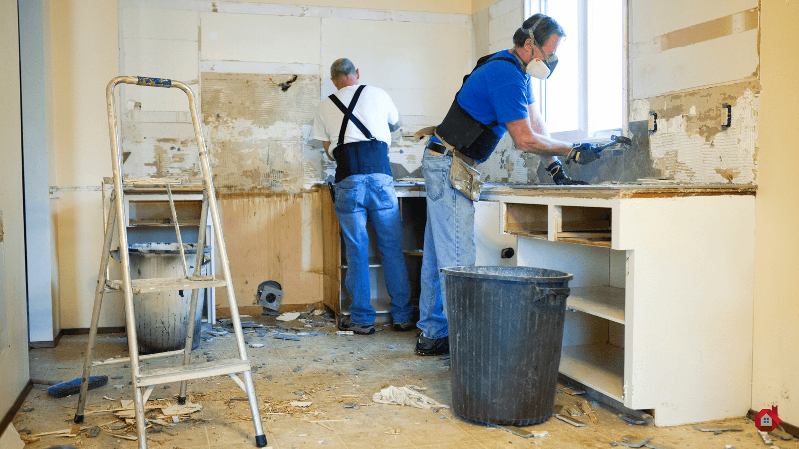 two contractor demolishing a kitchen&nbsp;
