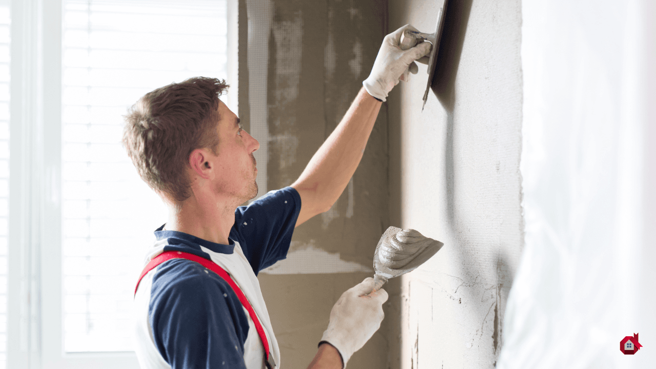 contractor plastering the wall