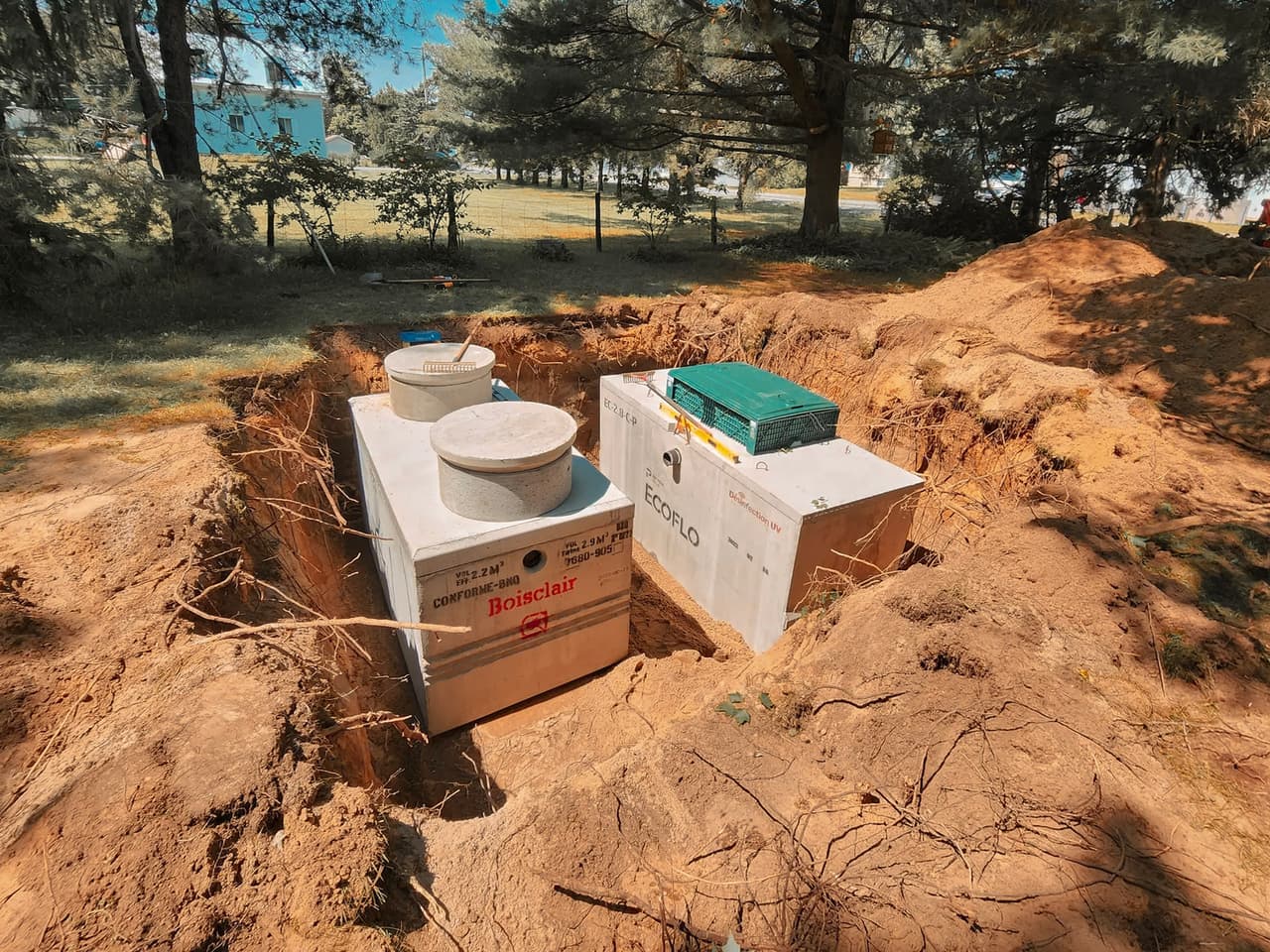 Installation of an Ecoflo septic tank with wastewater treatment system in a residential project.