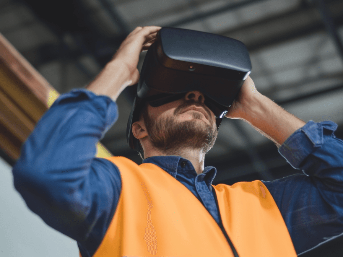 Construction engineer using a virtual reality headset for project modeling.