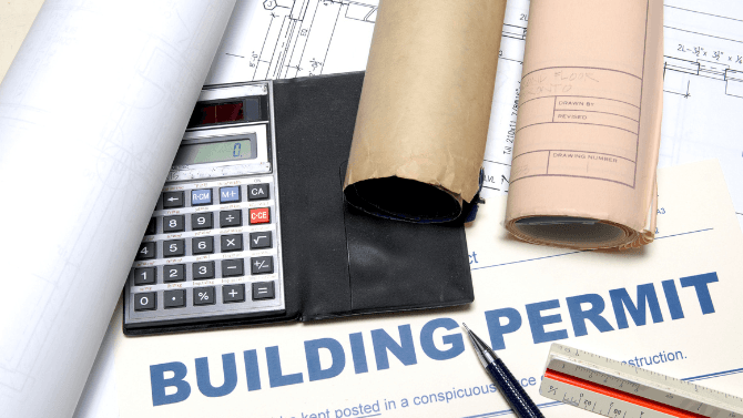 Building permit paper with plan and calculator&nbsp;