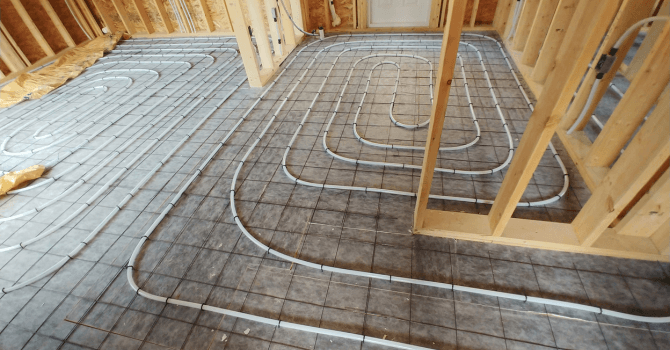 Underfloor heating cable laid atop a slab of concrete